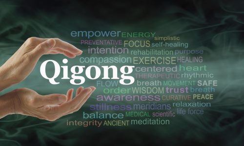 Qigong word cloud and healing hands – female cupped hands with the word QIGONG between surrounded by word cloud on a flowing green light and dark background Qigong word cloud and healing hands - female cupped hands with the word QIGONG between surrounded by word cloud on a flowing green light and dark background